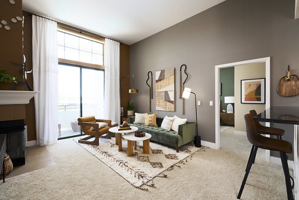 Modern living room with stylish furniture and natural light at Bridgepointe Apartments