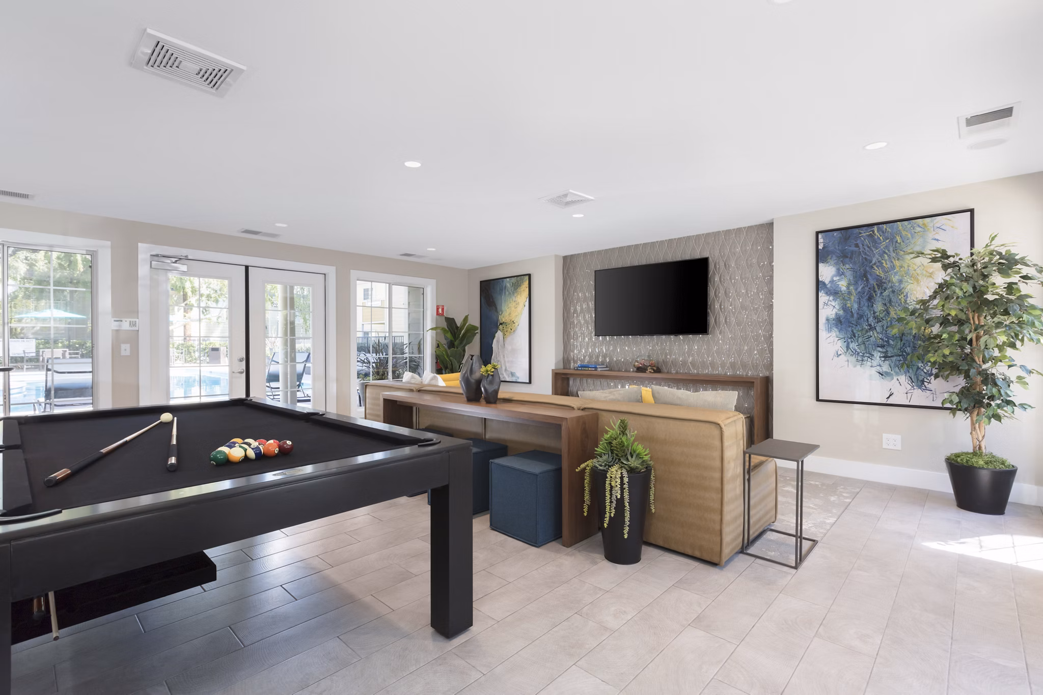 Clubhouse featuring modern design and cozy seating at Central Park at Whisman Station Apartments, offering a community space for residents