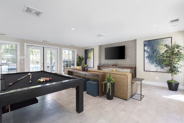 Clubhouse featuring modern design and cozy seating at Central Park at Whisman Station Apartments, offering a community space for residents