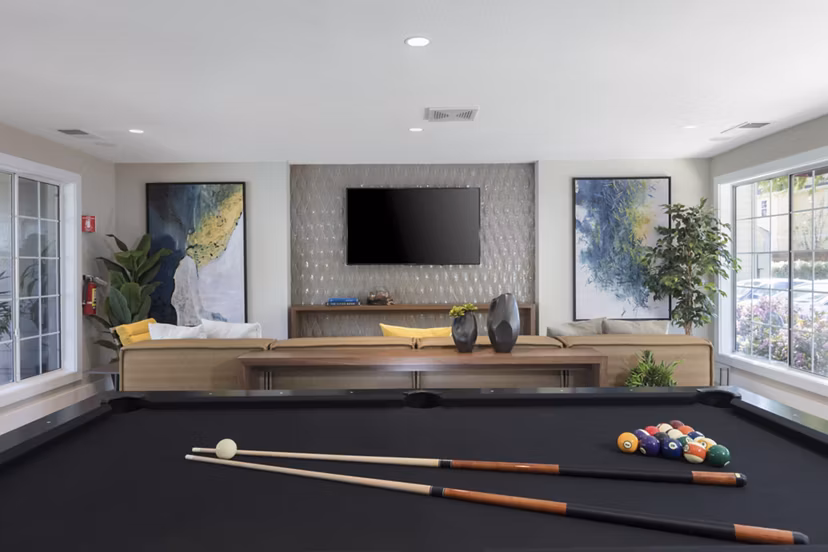 Clubhouse with modern design and community spaces at Central Park at Whisman Station Apartments