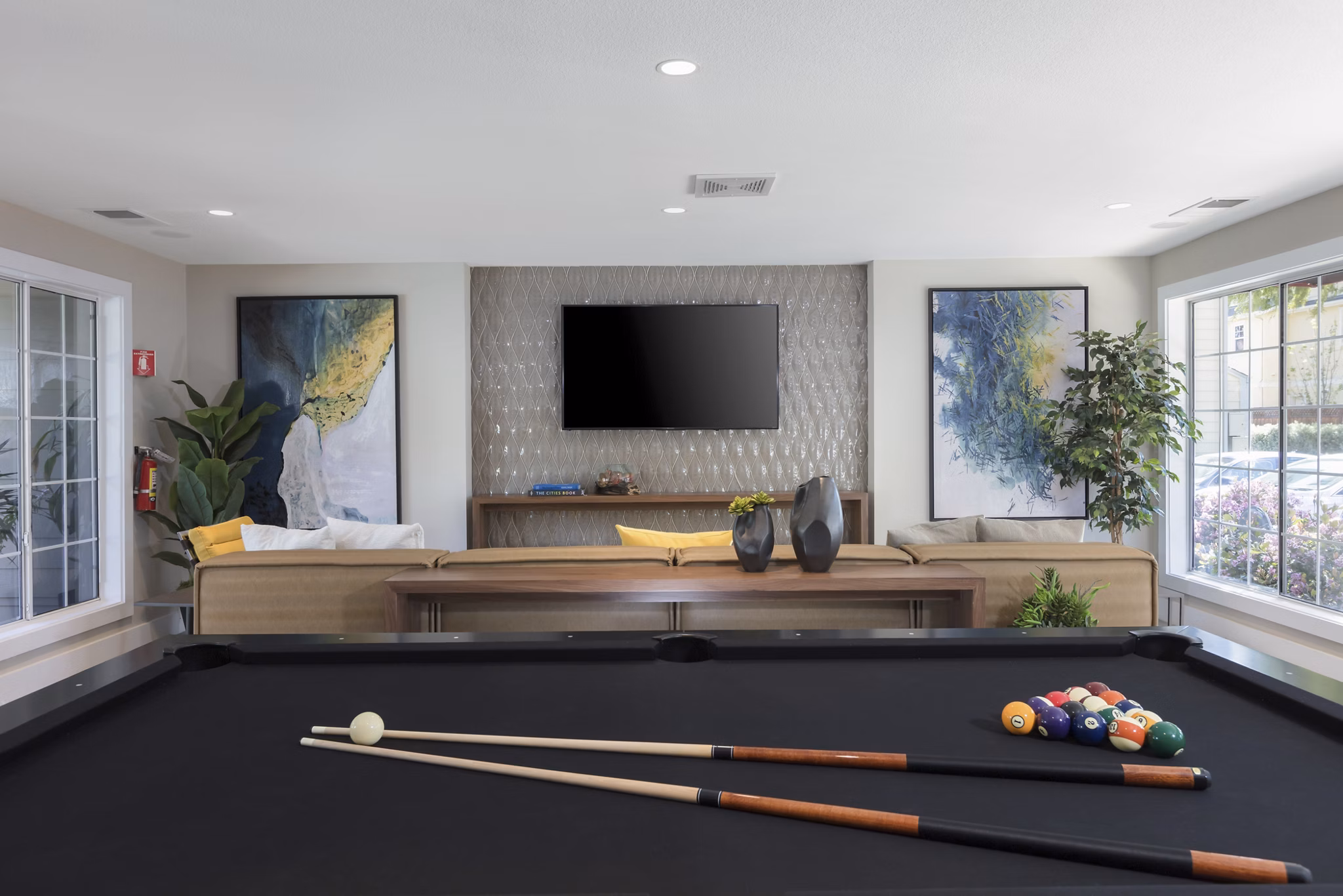Clubhouse with modern design and community spaces at Central Park at Whisman Station Apartments