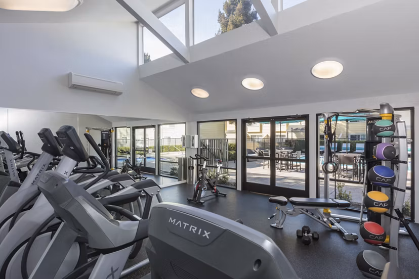 State-of-the-art fitness center at Central Park at Whisman Station Apartments with modern equipment and space for workouts