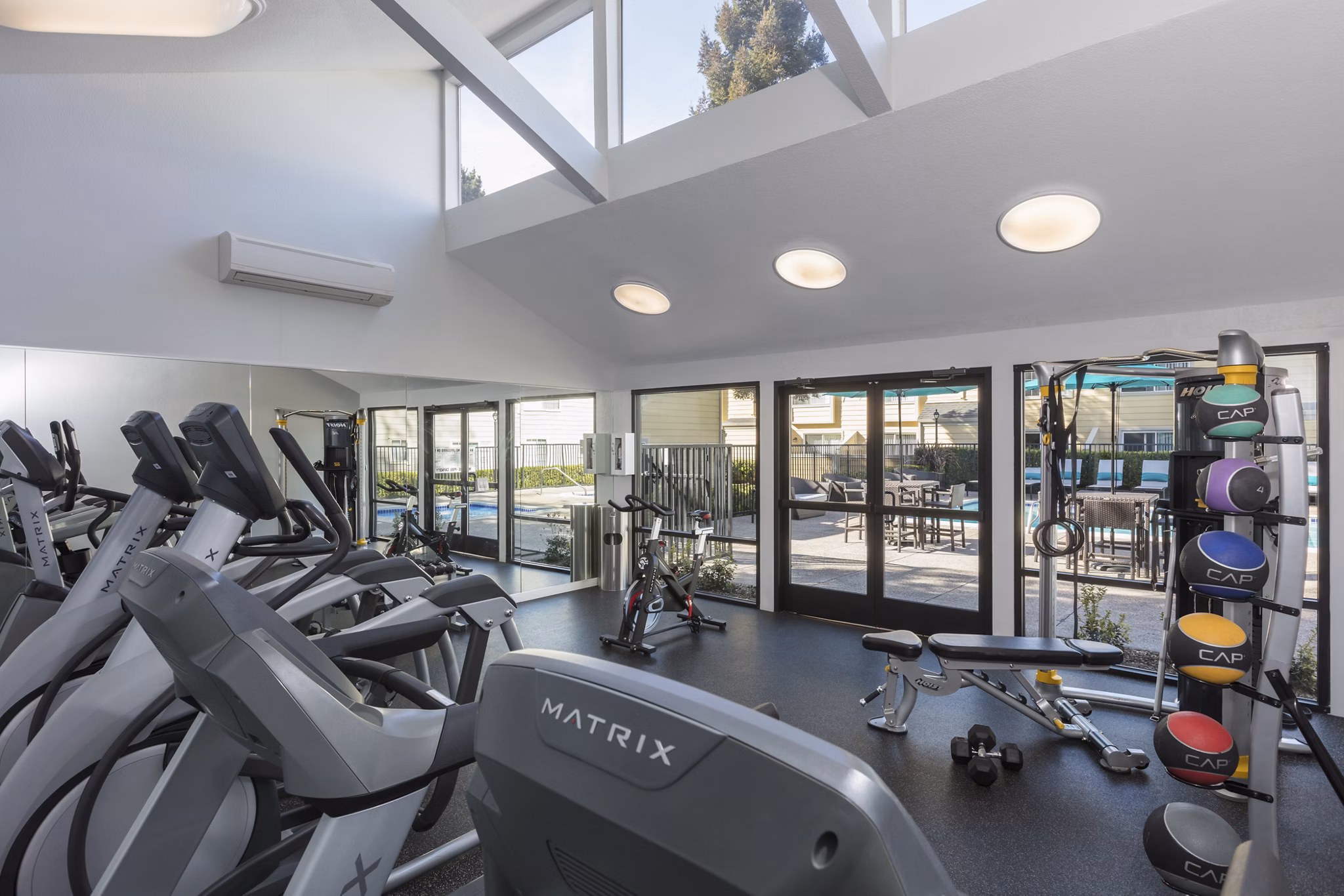 State-of-the-art fitness center at Central Park at Whisman Station Apartments with modern equipment and space for workouts