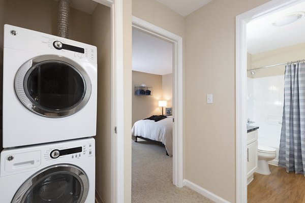 Spacious laundry room with modern appliances at Central Park at Whisman Station Apartments