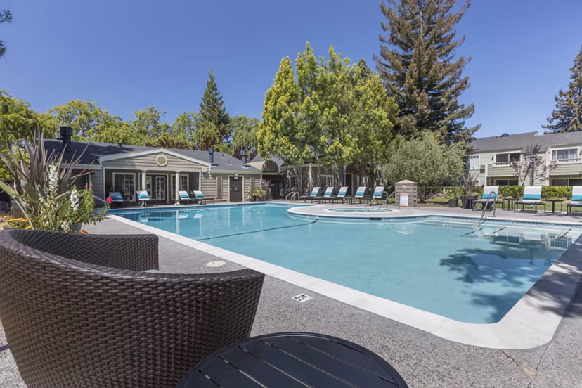Luxurious pool with lounge seating at Central Park at Whisman Station Apartments, ideal for relaxation and social gatherings