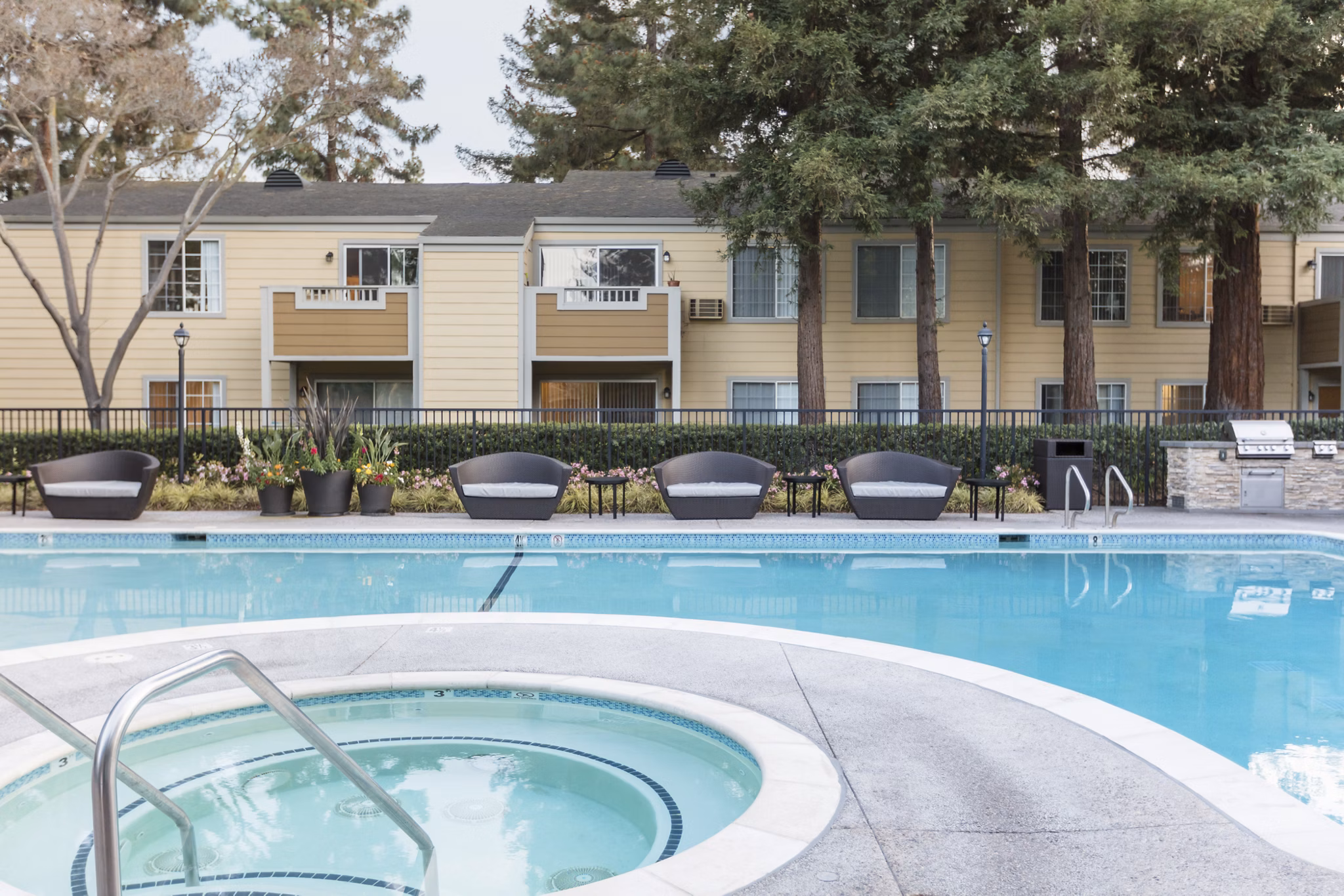 Outdoor pool with lounge area at Central Park at Whisman Station Apartments