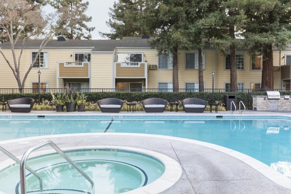 Outdoor pool with lounge area at Central Park at Whisman Station Apartments