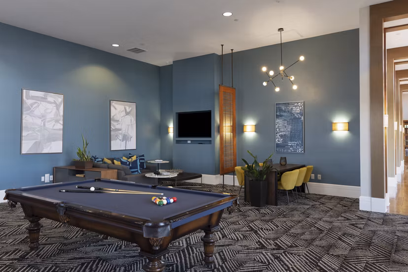 Clubhouse featuring stylish seating and modern design at Domicilio Apartments luxury community