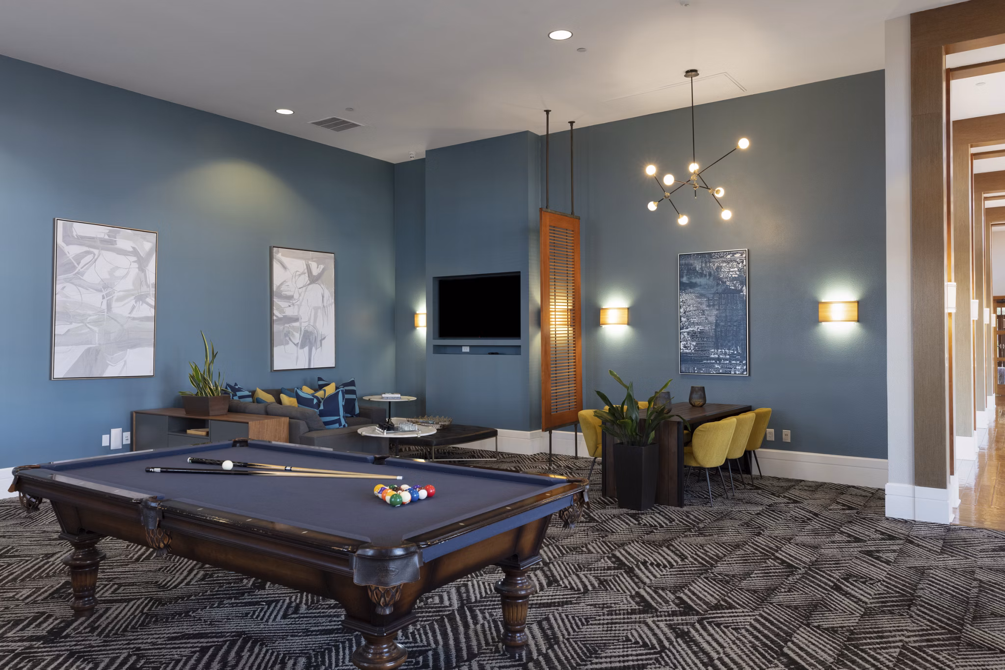 Clubhouse featuring stylish seating and modern design at Domicilio Apartments luxury community