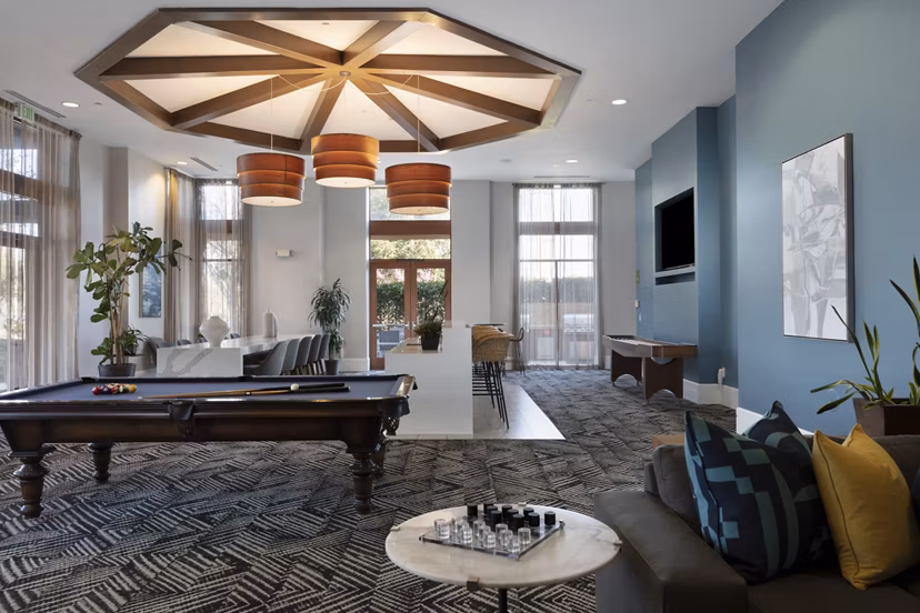 Clubhouse with modern design and cozy seating at Domicilio Apartments, a luxury Greystar property in vibrant Silicon Valley