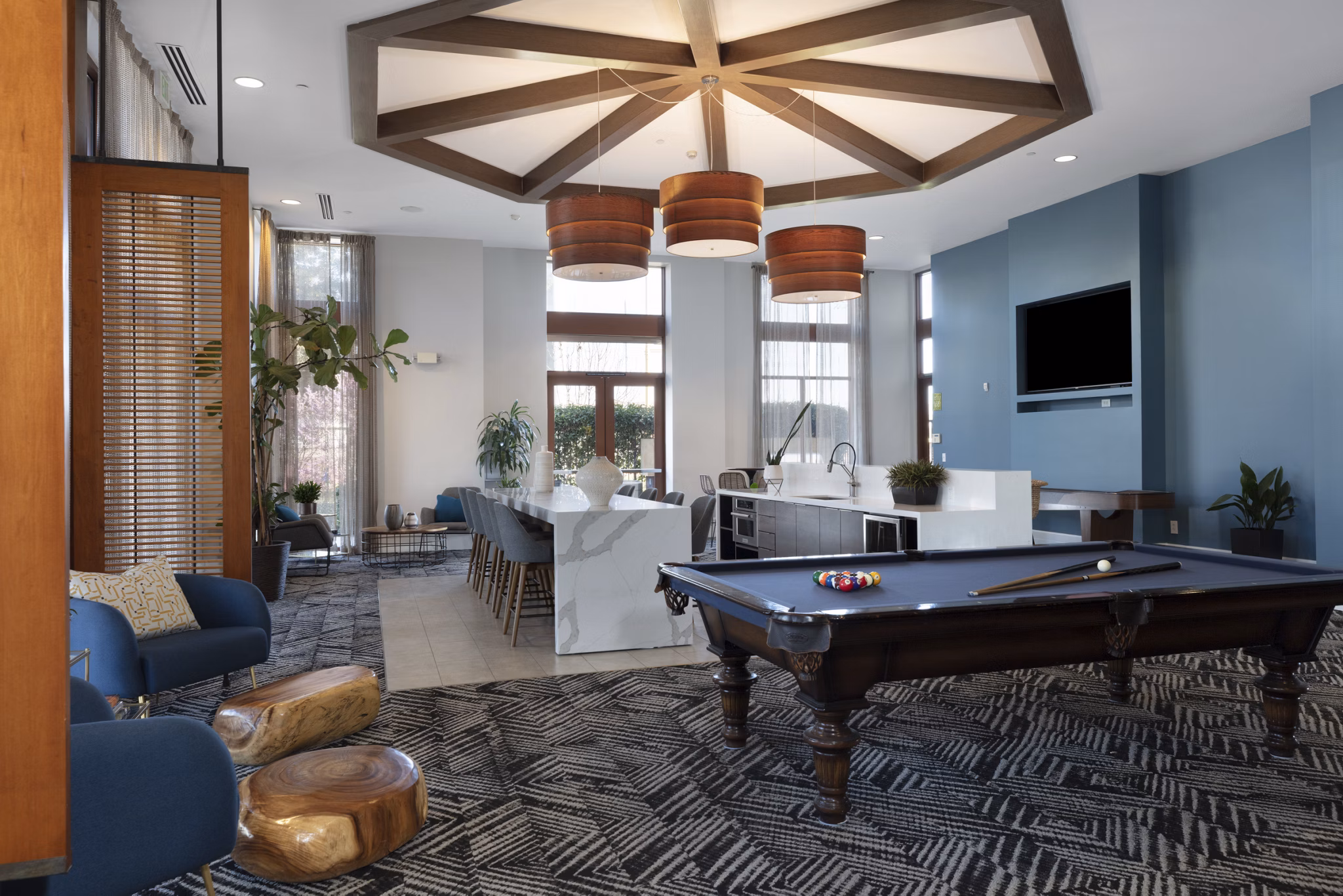 Domicilio Apartments: Elegant clubhouse with modern design and comfortable seating