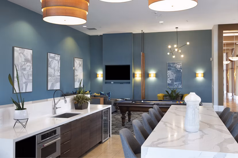 Club room with stylish seating and modern decor at Domicilio Apartments Luxury Apartments