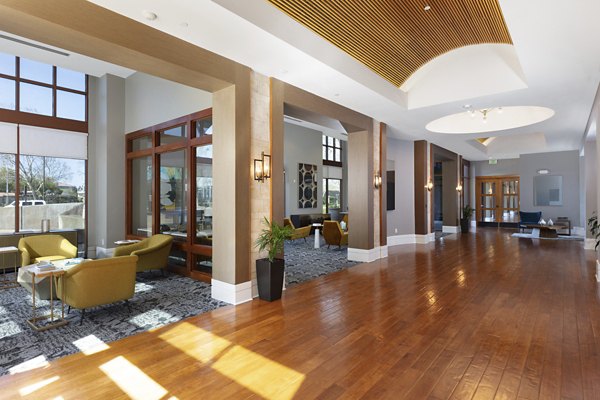 Clubhouse featuring modern lounge and entertainment spaces at Domicilio Apartments