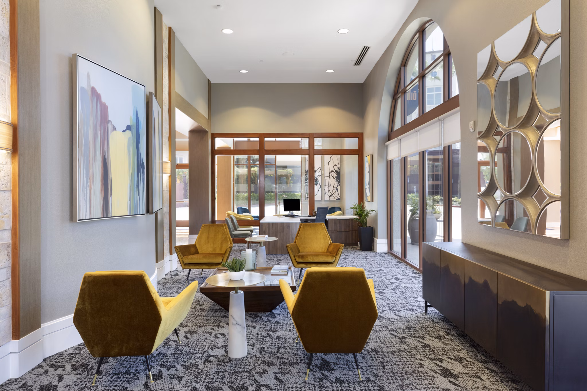 Modern clubhouse with elegant design at Domicilio Apartments, featuring plush seating and social spaces for luxury living in Santa Clara