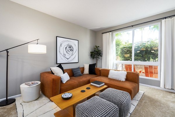 Living room with modern decor and spacious layout at Domicilio Apartments luxury residences