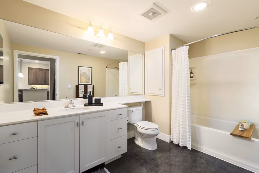Elegant bathroom with marble finishes in Elements Apartments, a Greystar luxury property