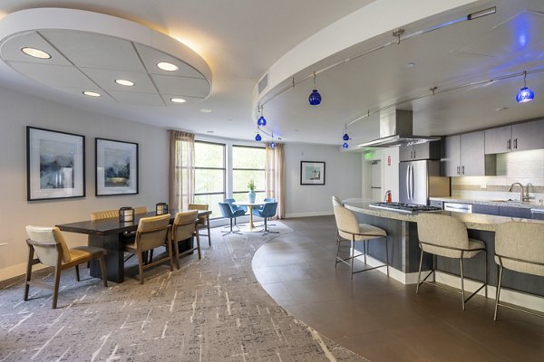 Clubhouse featuring modern design and comfortable seating at Elements Apartments, luxury living by Greystar