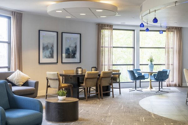 Modern clubhouse with stylish seating and decor at Elements Apartments luxury community