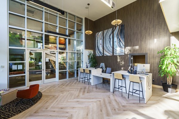 Modern clubhouse with stylish lounge seating at Elements Apartments offering a luxurious community experience
