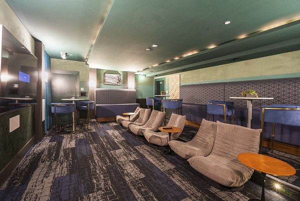 Theater room with plush seating at Elements Apartments, a luxury Greystar community