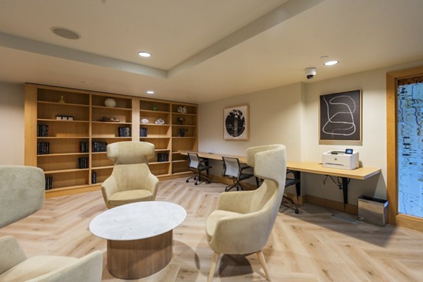 Business center with modern workstations at Elements Apartments