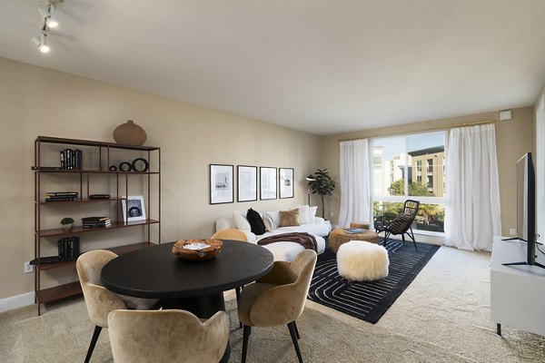 Dining area with modern furniture and stylish lighting in Elements Apartments, a Greystar luxury community