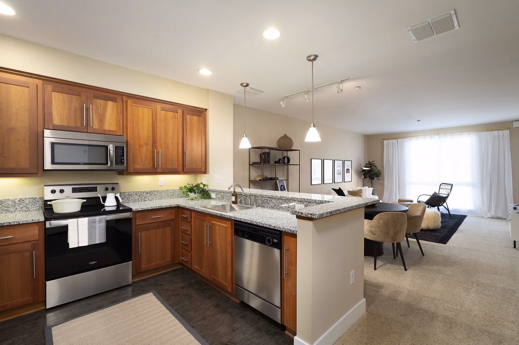 Modern kitchen featuring sleek countertops and stainless steel appliances at Elements Apartments