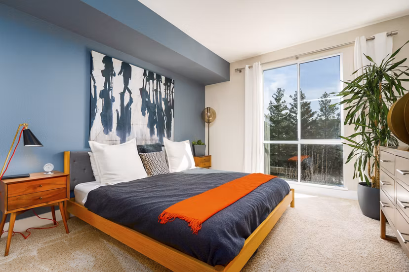 Cozy bedroom with elegant decor at Mosaic Apartments luxury living