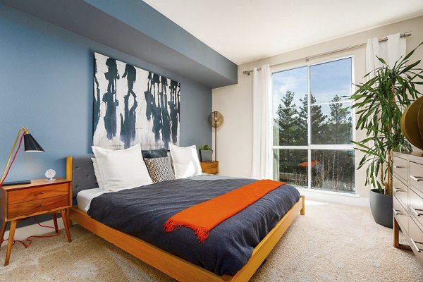 Cozy bedroom with elegant decor at Mosaic Apartments luxury living