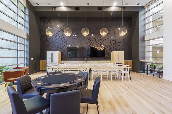 Clubhouse offering modern communal seating and entertainment areas at Mosaic Apartments