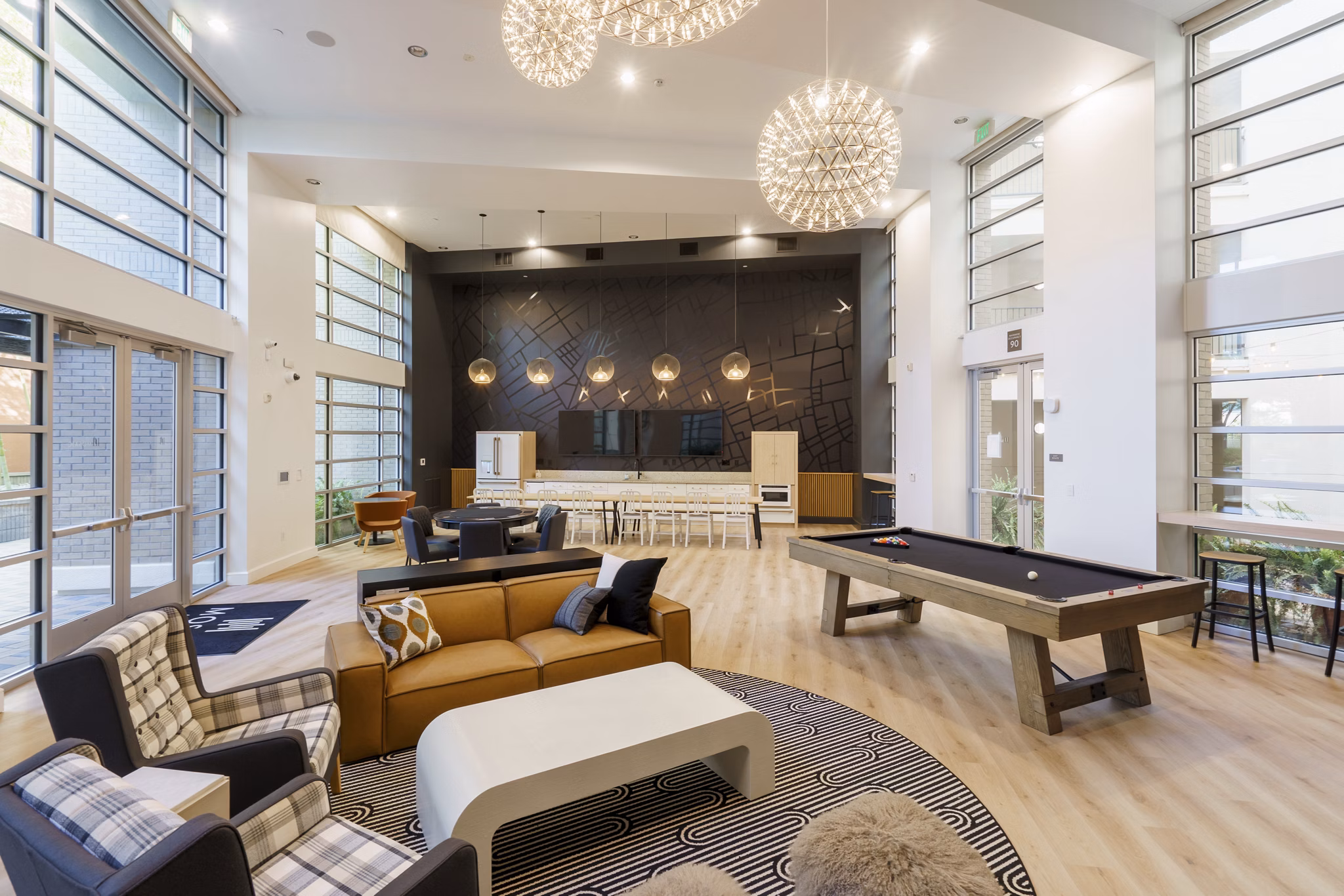 Clubhouse with modern design and vibrant seating at Mosaic Apartments