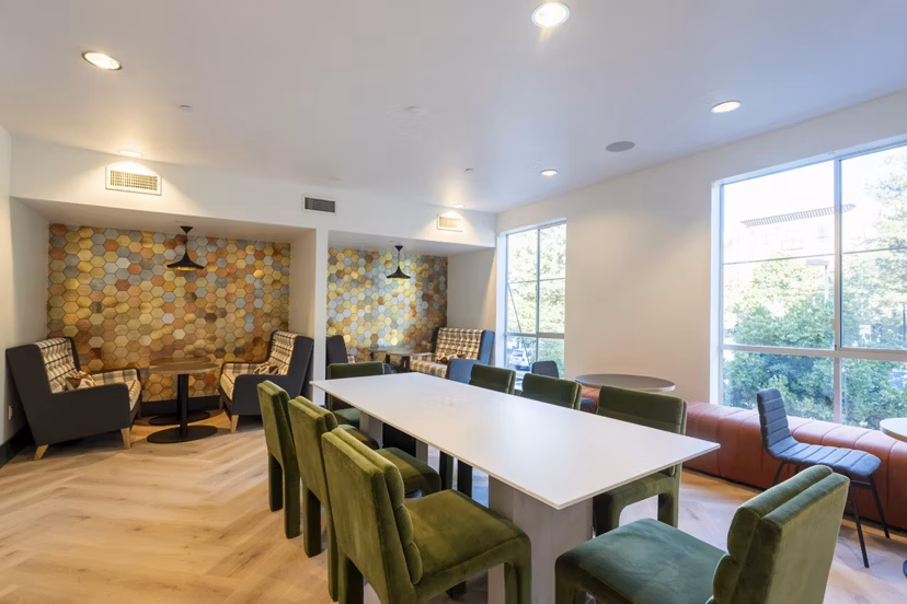 Dining room with modern decor and natural light at Mosaic Apartments