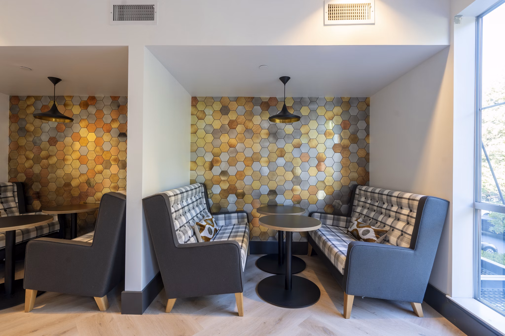 Dining room featuring modern decor and ample seating at Mosaic Apartments