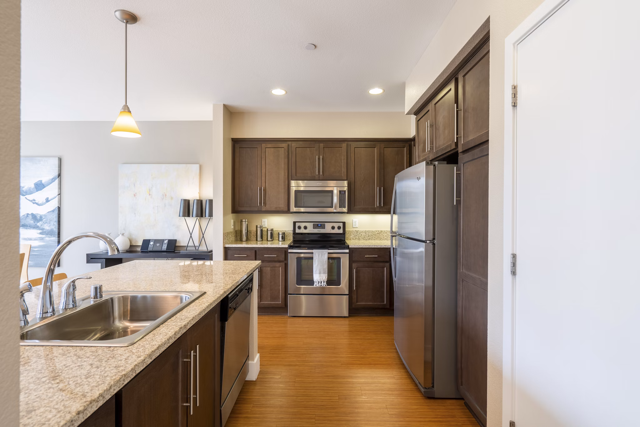 Modern kitchen with stainless steel appliances at Mosaic Apartments, a Greystar luxury community