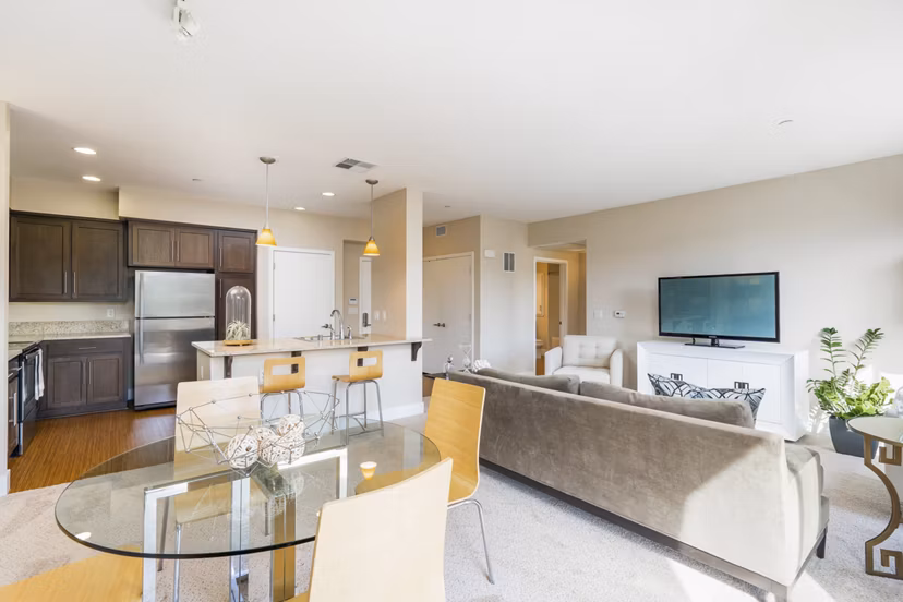 Spacious living room with modern decor in Mosaic Apartments, available at Greystar luxury apartment community