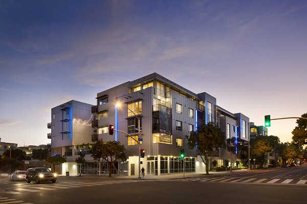 Night view of front of building at Sway Apartments