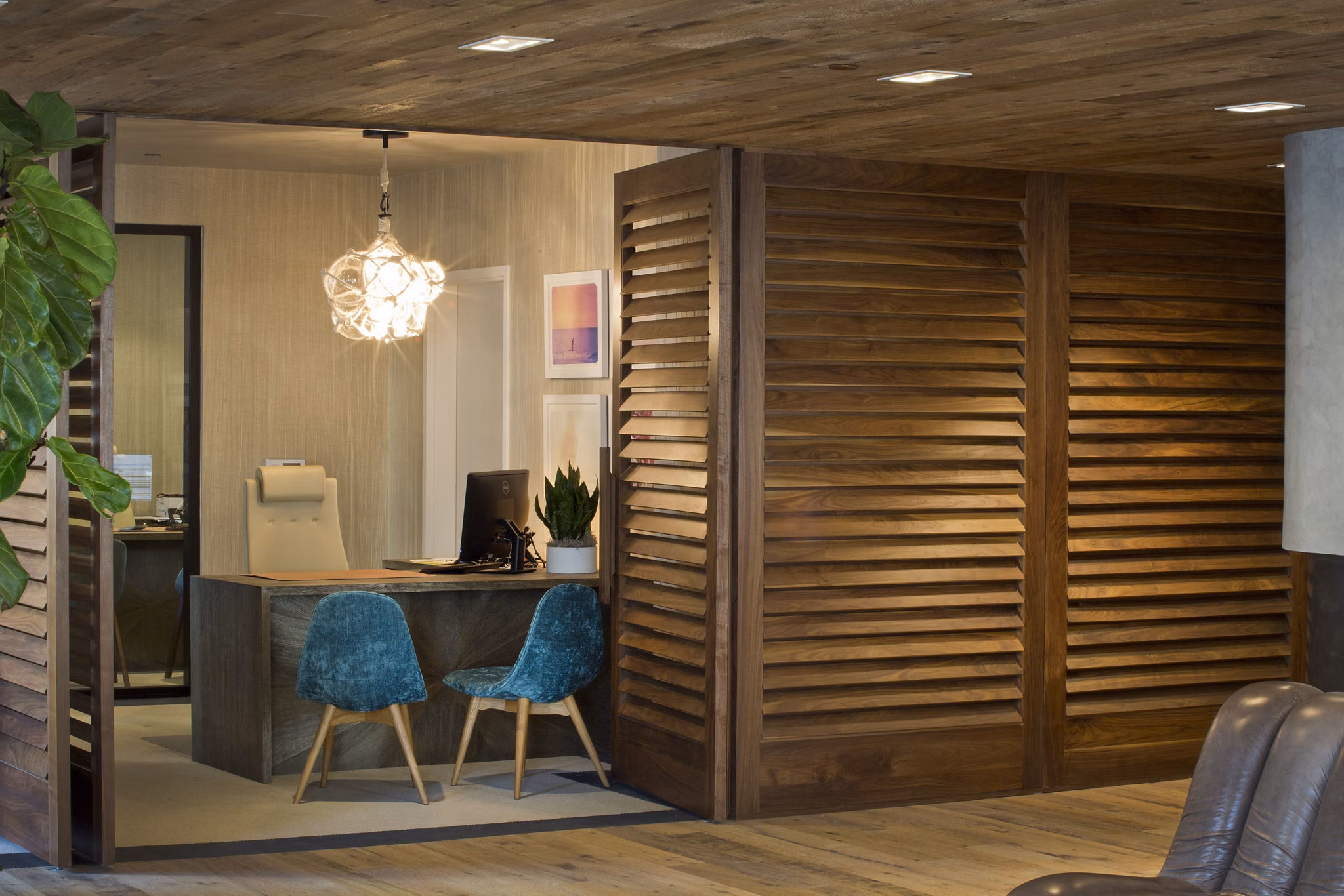 Lobby with modern seating and art at Sway Apartments clubhouse