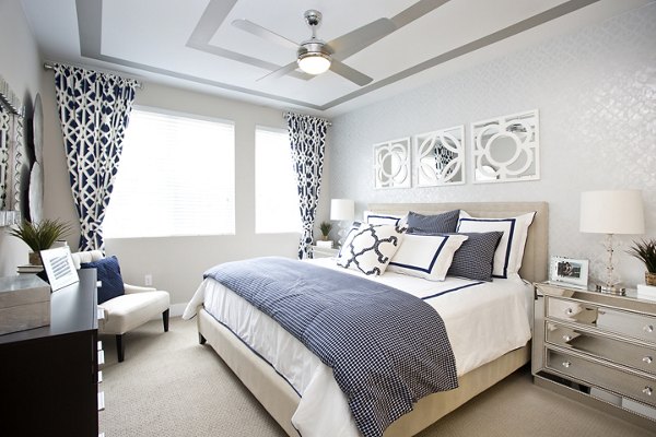 Cozy bedroom with modern decor at Broadstone on 9th Apartments, showcasing luxury living and comfort in a desirable location