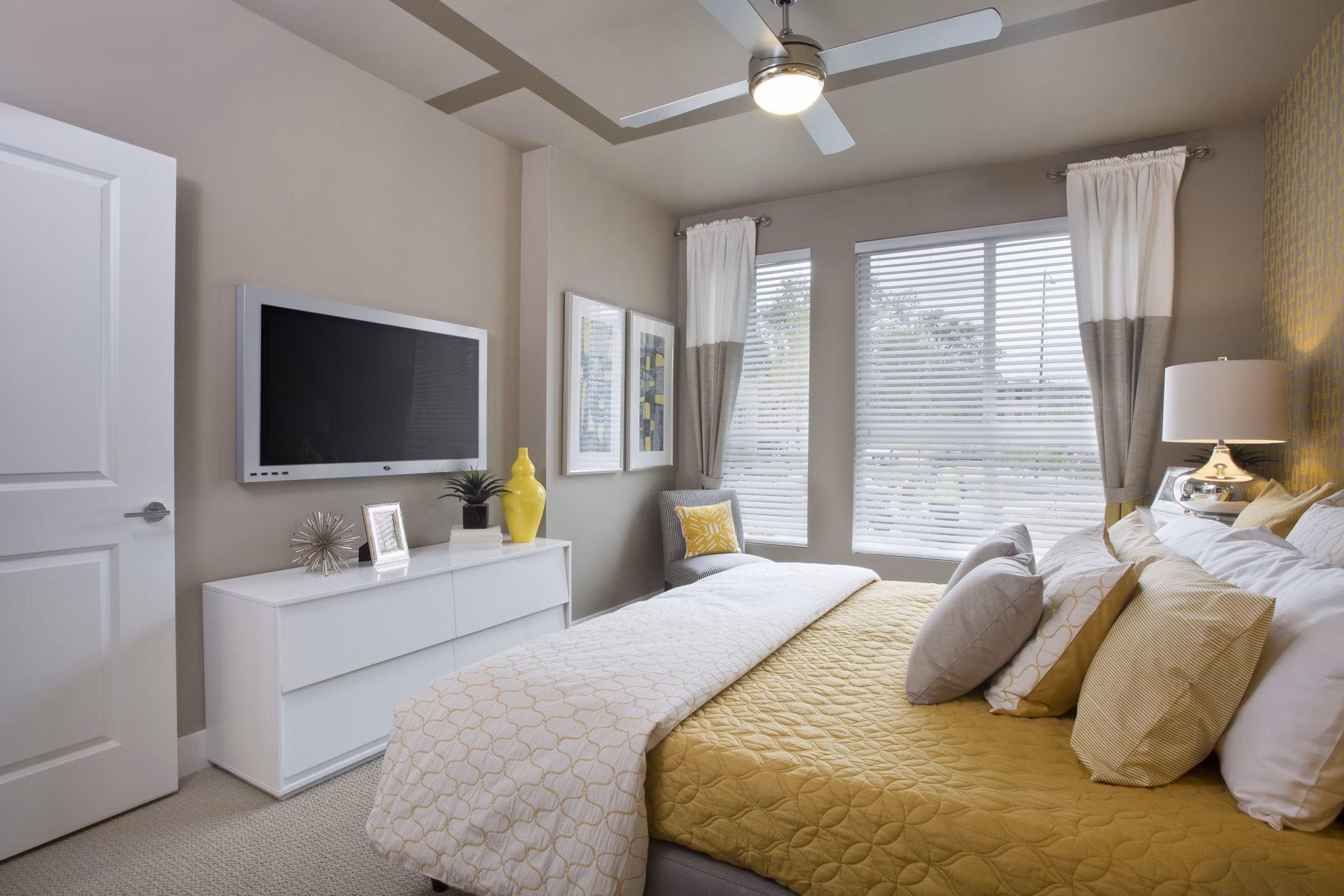 Cozy bedroom with modern decor at Broadstone on 9th Apartments featuring luxury amenities