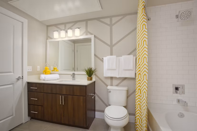Modern bathroom featuring sleek fixtures and spacious layout at Broadstone on 9th Apartments