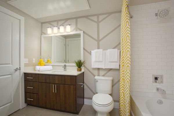 Modern bathroom featuring sleek fixtures and spacious layout at Broadstone on 9th Apartments