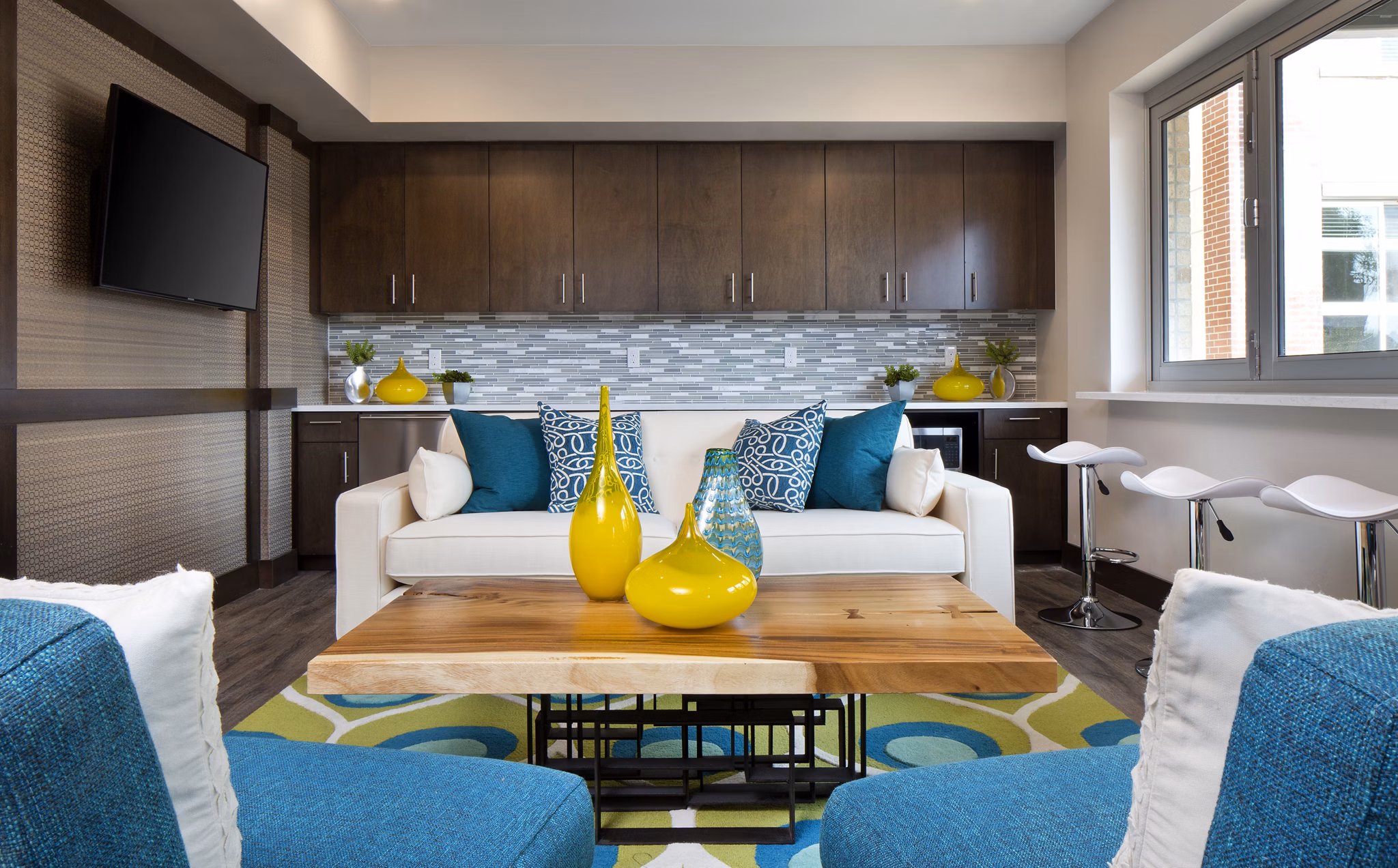 Clubhouse with modern decor and seating at Broadstone on 9th Apartments