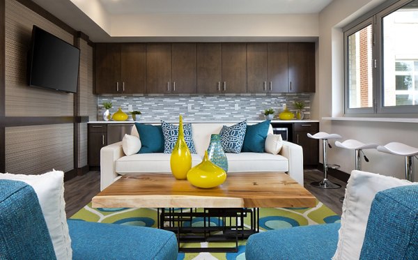 Clubhouse with modern decor and seating at Broadstone on 9th Apartments