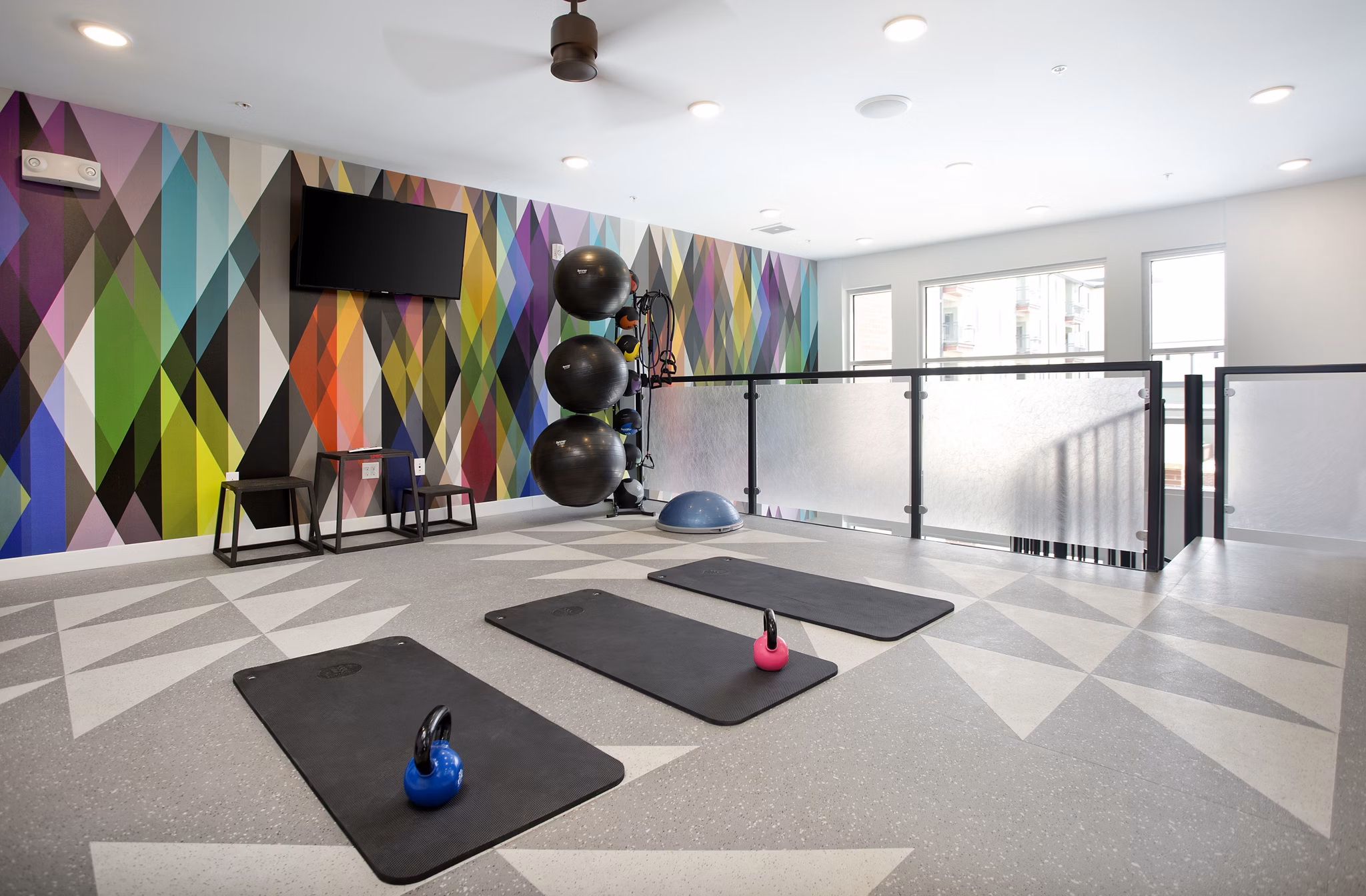 State-of-the-art fitness center at Broadstone on 9th Apartments with modern equipment and ample space for workouts