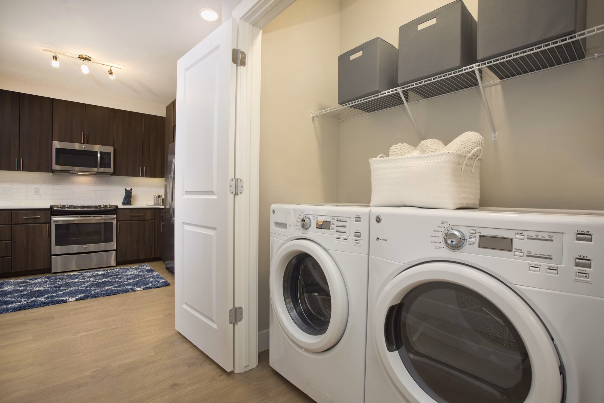 Laundry room with modern washers and dryers at Broadstone on 9th Apartments, luxury living in a prime location