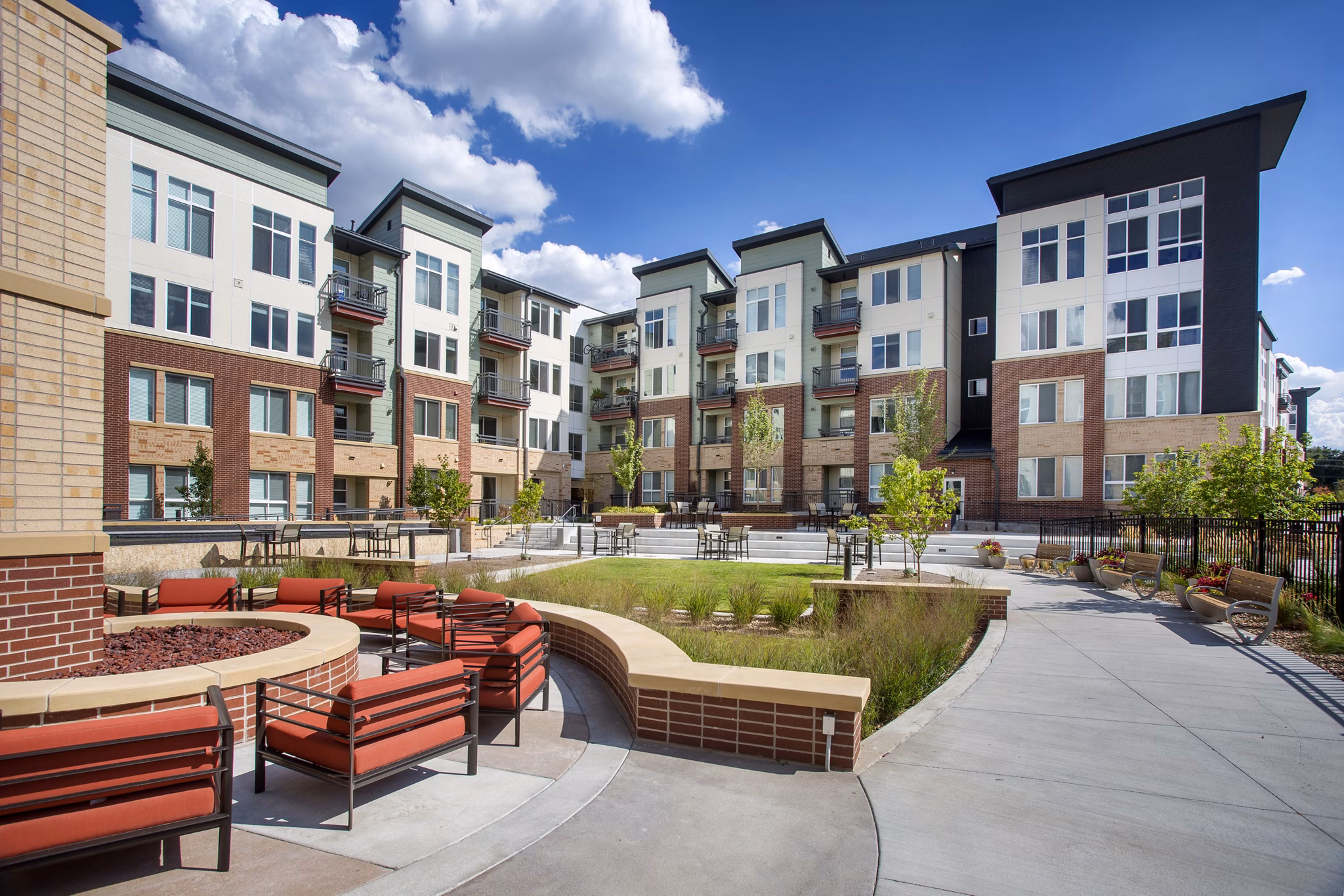 Broadstone on 9th Apartments: Tranquil courtyard featuring lush gardens and seating areas in Salt Lake City