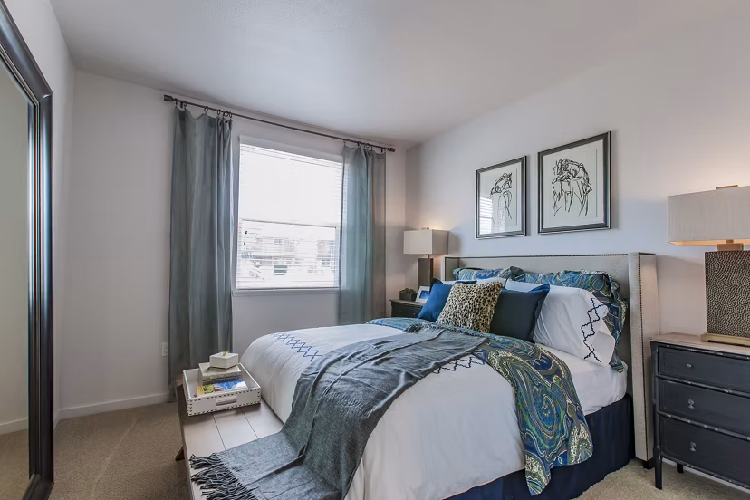 Spacious bedroom with modern decor at The Artisan Apartments, offering luxury living experiences
