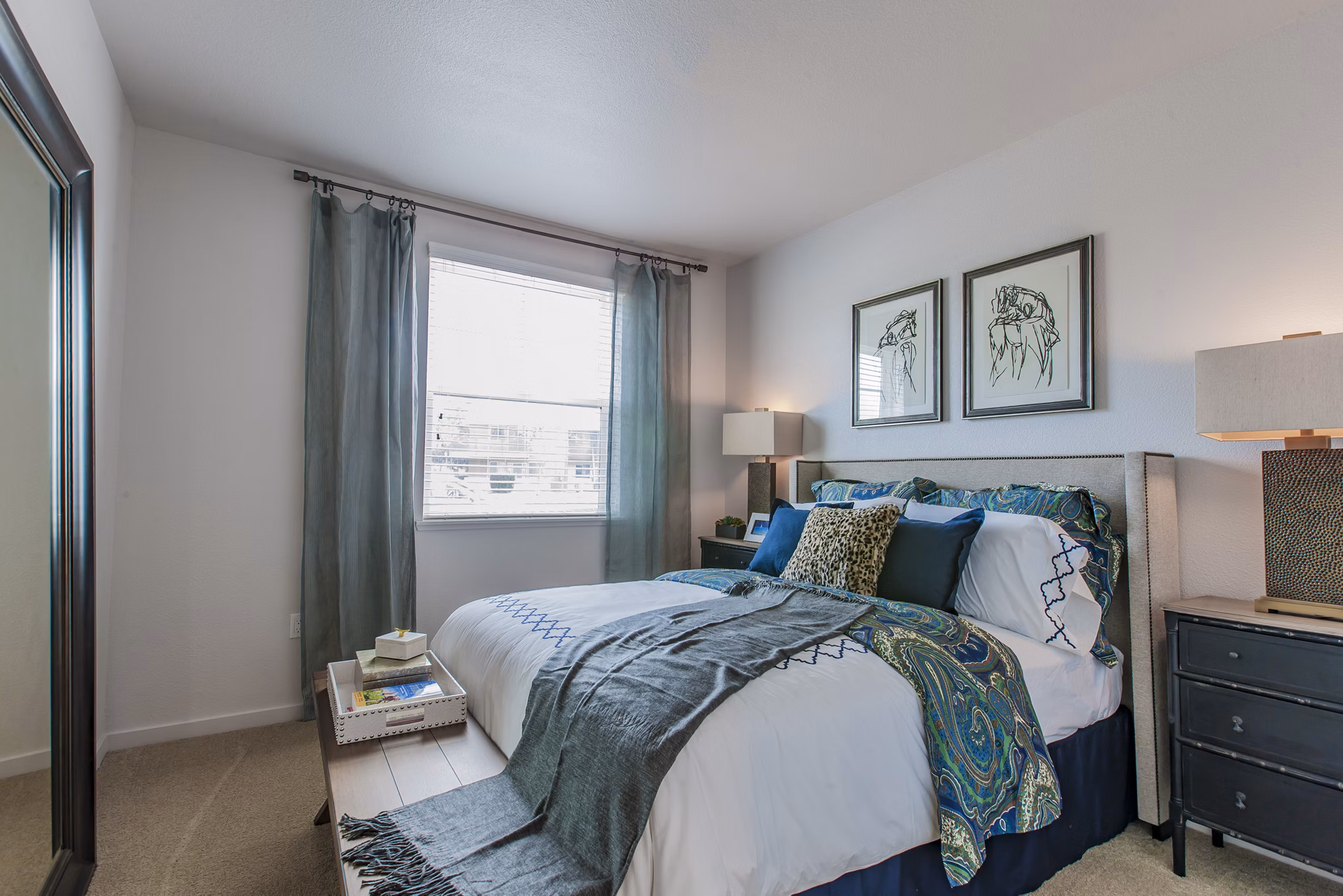 Spacious bedroom with modern decor at The Artisan Apartments, offering luxury living experiences