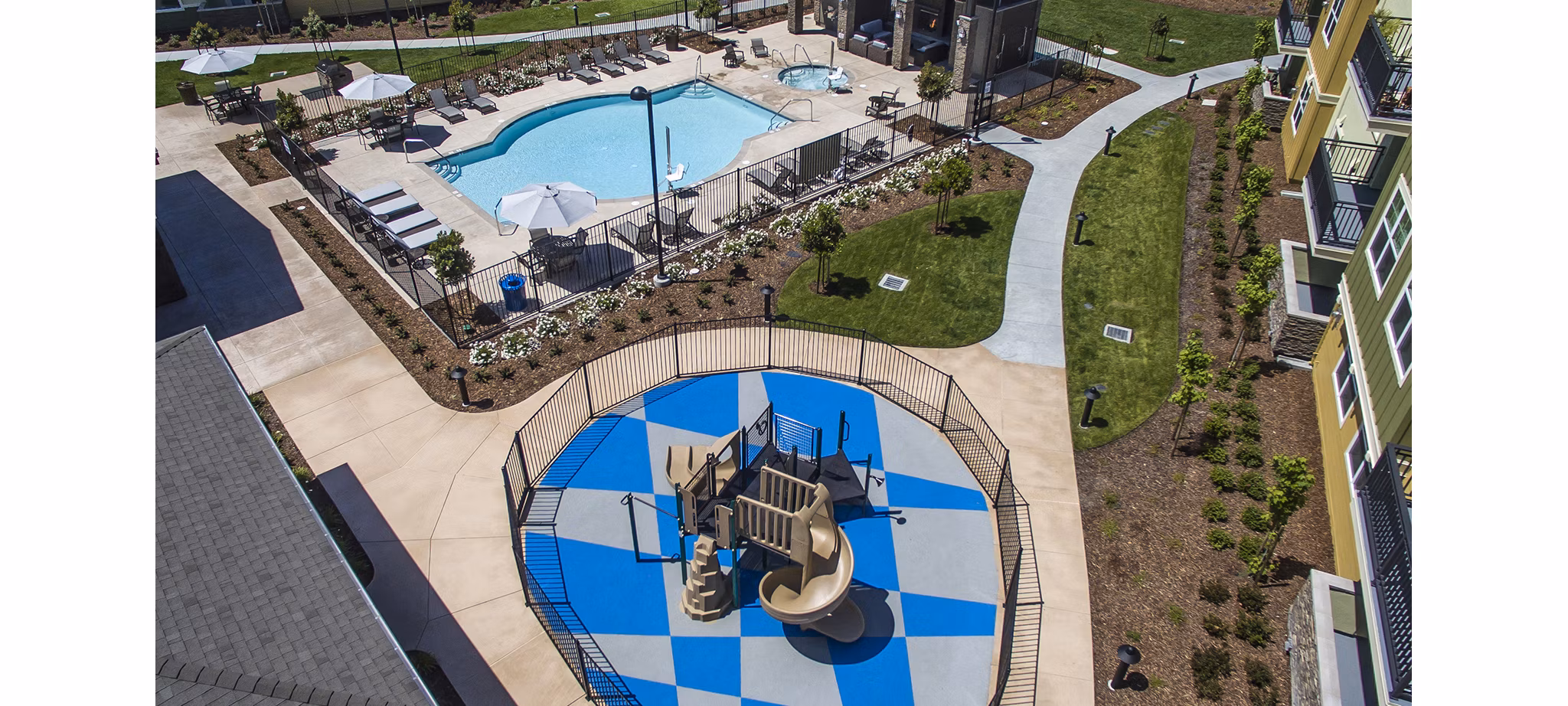 The Artisan Apartments: Luxury pool area with lounge chairs and cabanas