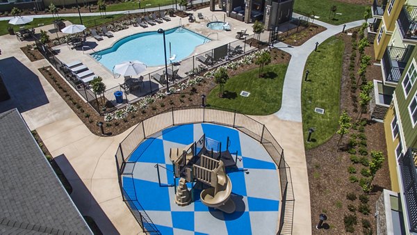 The Artisan Apartments: Luxury pool area with lounge chairs and cabanas
